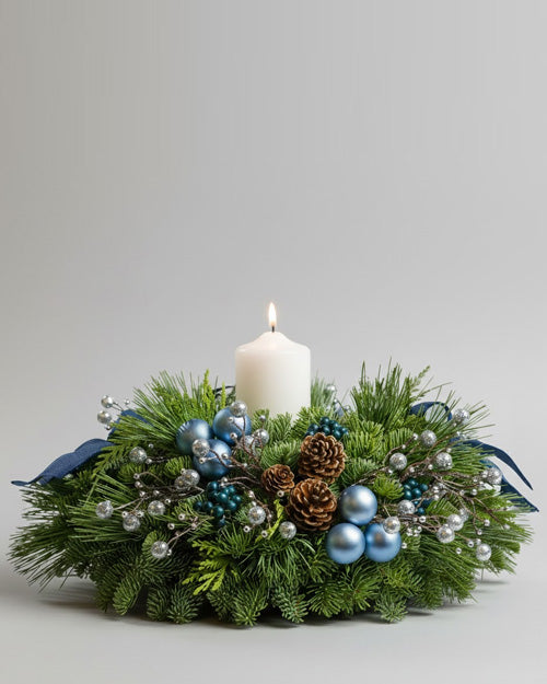 Winter Glow arrangement with silver and blue - luminous holiday centerpiece.